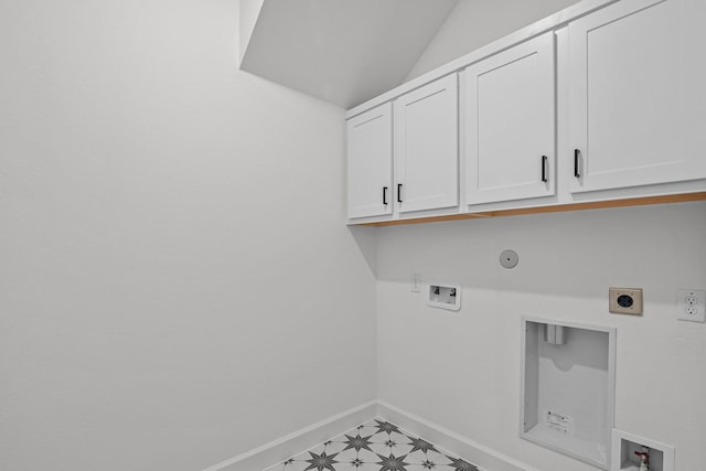 laundry area with hookup for a gas dryer, hookup for a washing machine, hookup for an electric dryer, and cabinets