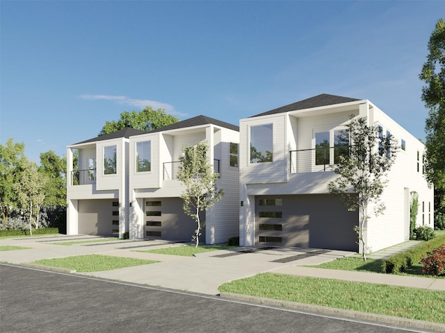 contemporary house with a balcony and a garage