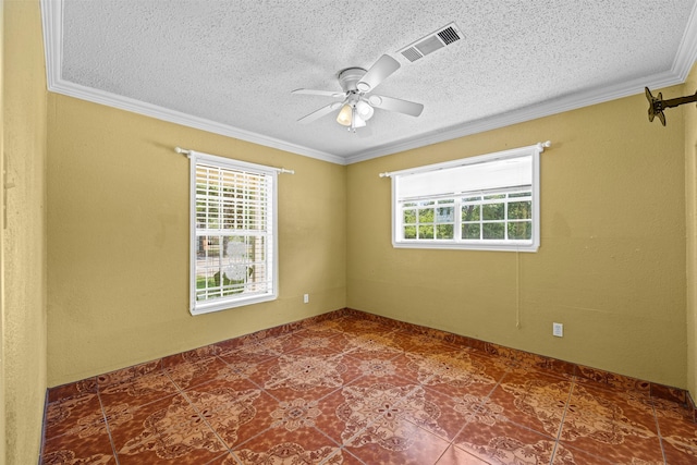 spare room with ornamental molding, a healthy amount of sunlight, a textured ceiling, and ceiling fan