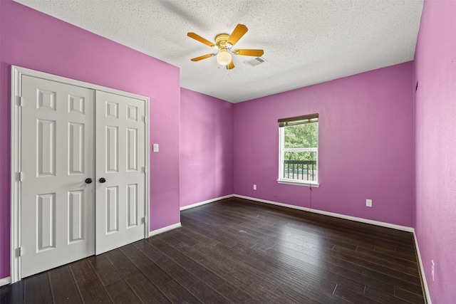 unfurnished bedroom featuring hardwood / wood-style flooring, ceiling fan, a textured ceiling, and a closet