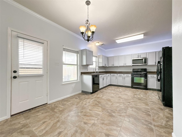 kitchen featuring crown molding, sink, hanging light fixtures, and black appliances