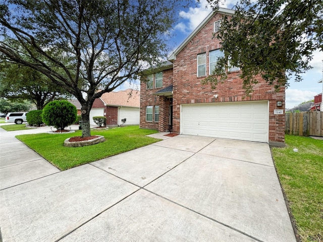 view of front of home featuring a garage and a front lawn