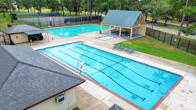 view of pool with a yard and a patio area