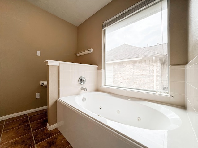 bathroom featuring tile patterned flooring and a bathtub