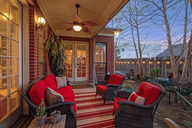 view of patio / terrace with french doors and fence