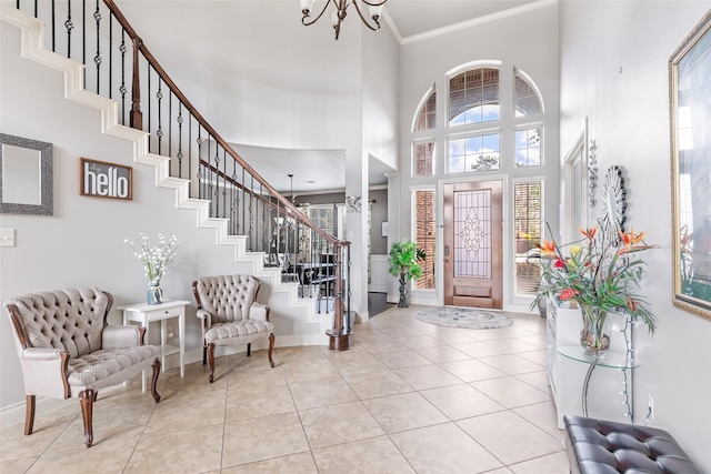16211 Florida View Ln, Houston, TX 77044 - foyer featuring crown molding, stairway, a towering ceiling, a chandelier, and plenty of natural light