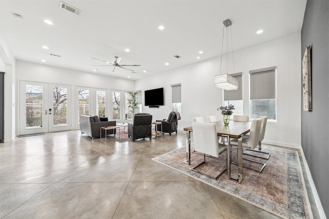 dining room with ceiling fan and french doors