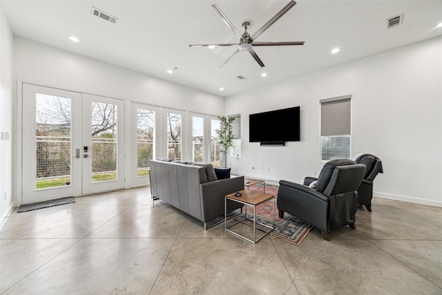 living room featuring french doors and ceiling fan