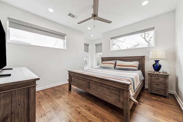 bedroom featuring dark hardwood / wood-style flooring and ceiling fan