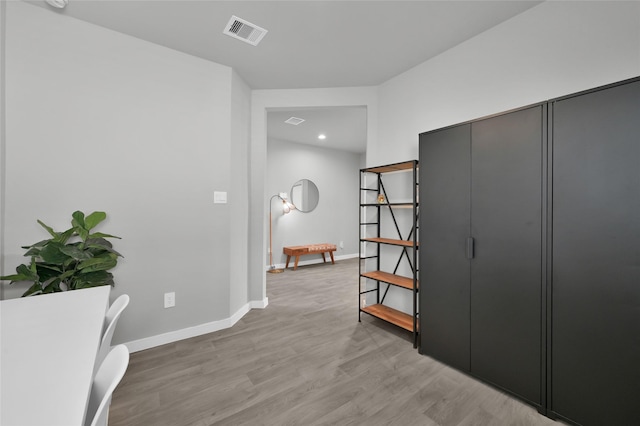 corridor featuring hardwood / wood-style floors