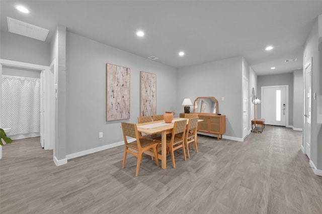 dining area with light hardwood / wood-style flooring