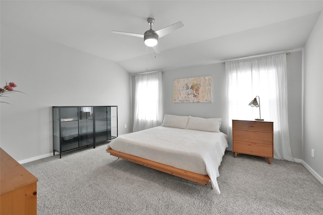 bedroom featuring lofted ceiling, light carpet, and ceiling fan