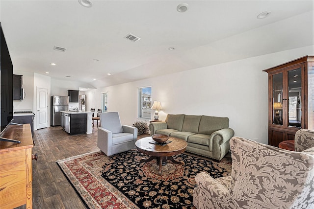 living room with dark hardwood / wood-style flooring