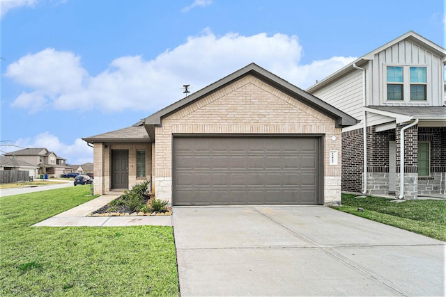 view of front of home featuring a garage and a front yard