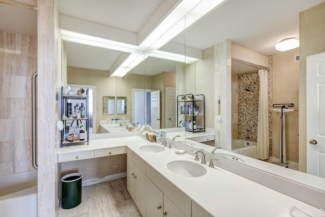 bathroom with vanity and shower / bath combo with shower curtain