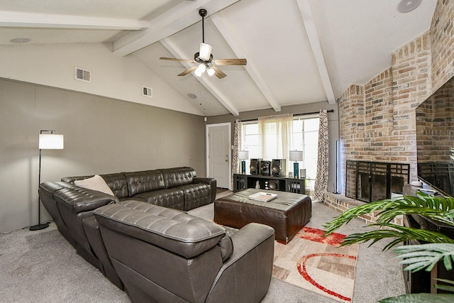 living room with a brick fireplace, light colored carpet, visible vents, and beam ceiling