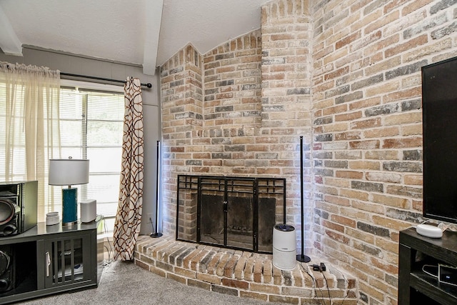 unfurnished living room with carpet, a fireplace, and a textured ceiling