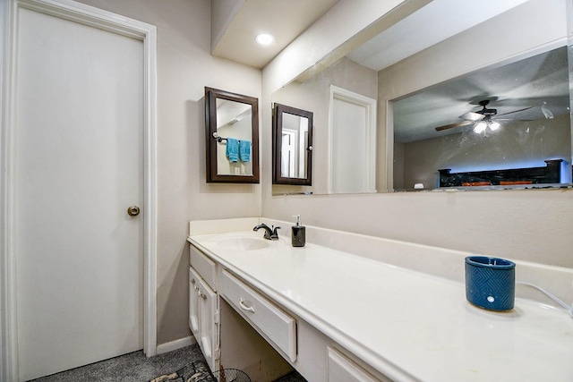 bathroom featuring baseboards, vanity, and a ceiling fan