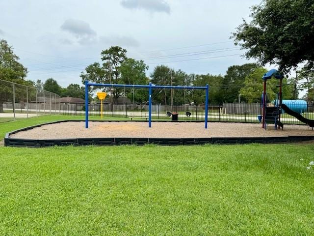 community playground with a yard and fence