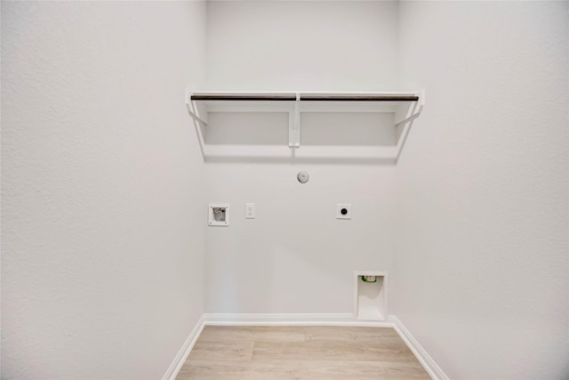 laundry room featuring gas dryer hookup, electric dryer hookup, washer hookup, and light hardwood / wood-style floors