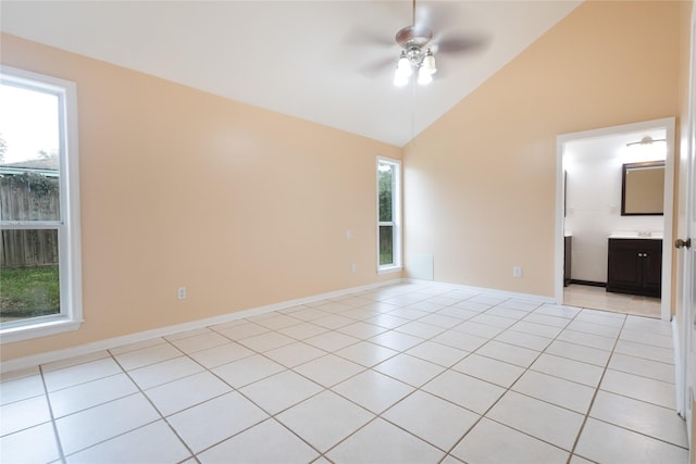 unfurnished room featuring lofted ceiling, light tile patterned floors, and ceiling fan