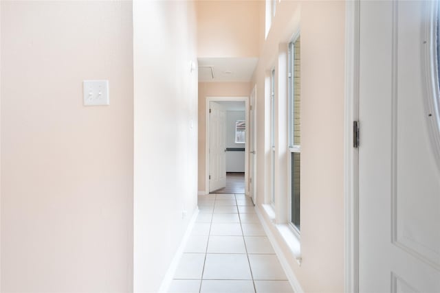 corridor featuring light tile patterned flooring