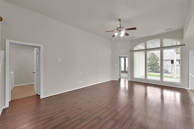 unfurnished room featuring dark hardwood / wood-style flooring and ceiling fan