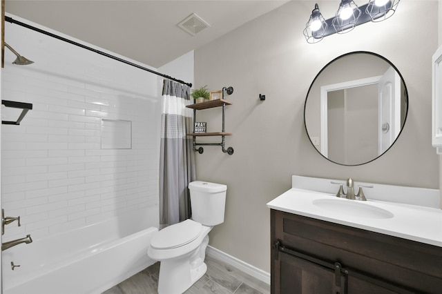 full bathroom featuring shower / tub combo with curtain, vanity, and toilet