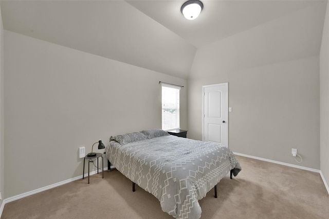 carpeted bedroom with vaulted ceiling