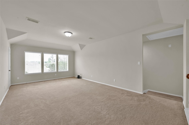 spare room featuring light colored carpet