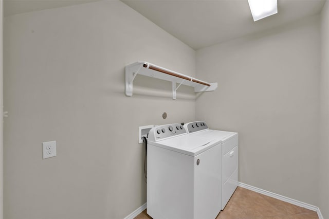 clothes washing area featuring washing machine and clothes dryer