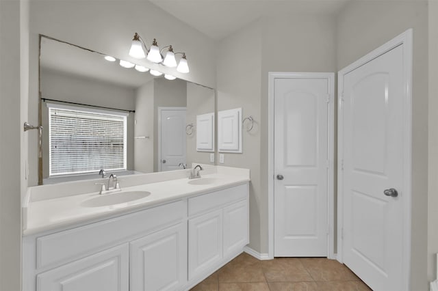 bathroom with tile patterned floors and vanity