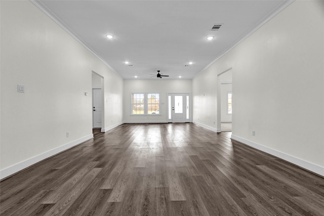 unfurnished living room with dark hardwood / wood-style flooring, crown molding, and ceiling fan