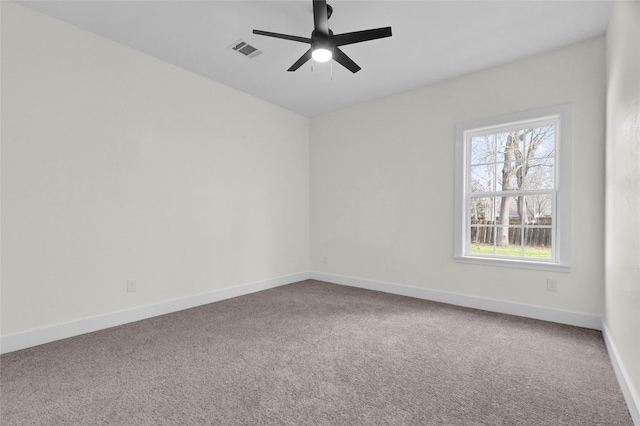 unfurnished room featuring ceiling fan and carpet flooring