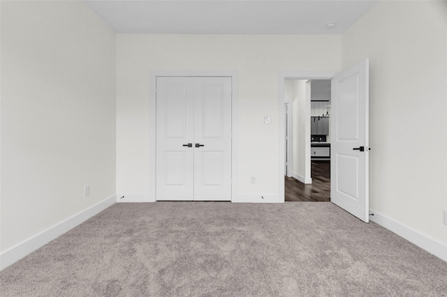 unfurnished bedroom with carpet floors and a closet