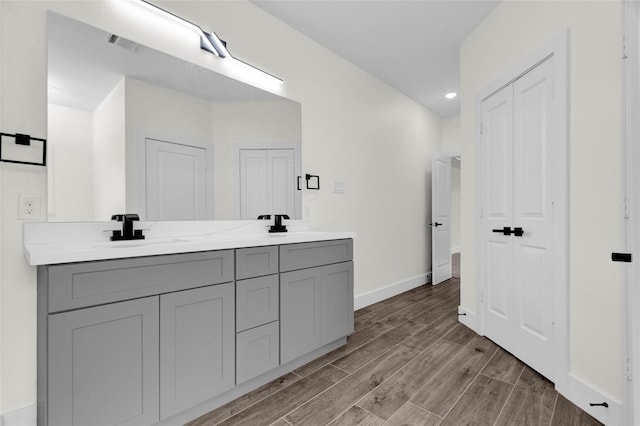 bathroom featuring vanity and wood-type flooring