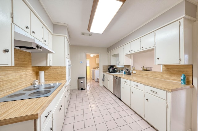 kitchen with backsplash, electric cooktop, dishwasher, and white cabinets