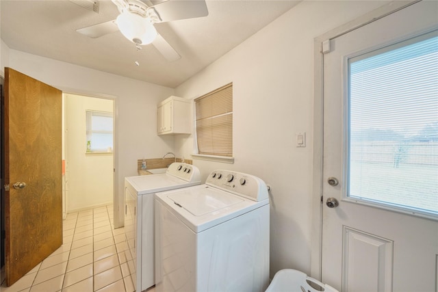 washroom with light tile patterned flooring, cabinets, ceiling fan, and washing machine and dryer