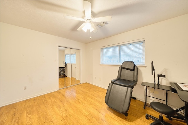 unfurnished room featuring ceiling fan and light wood-type flooring