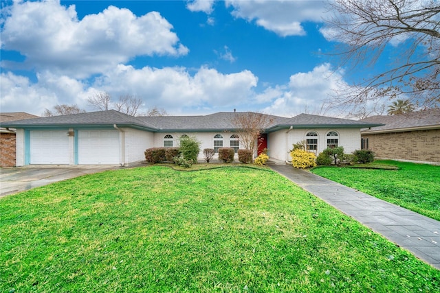 ranch-style house with a garage and a front lawn