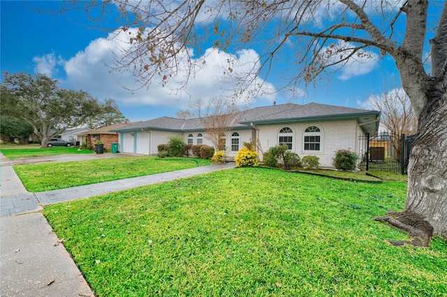 ranch-style home featuring a garage and a front yard