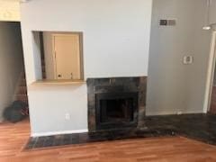 unfurnished living room with wood-type flooring