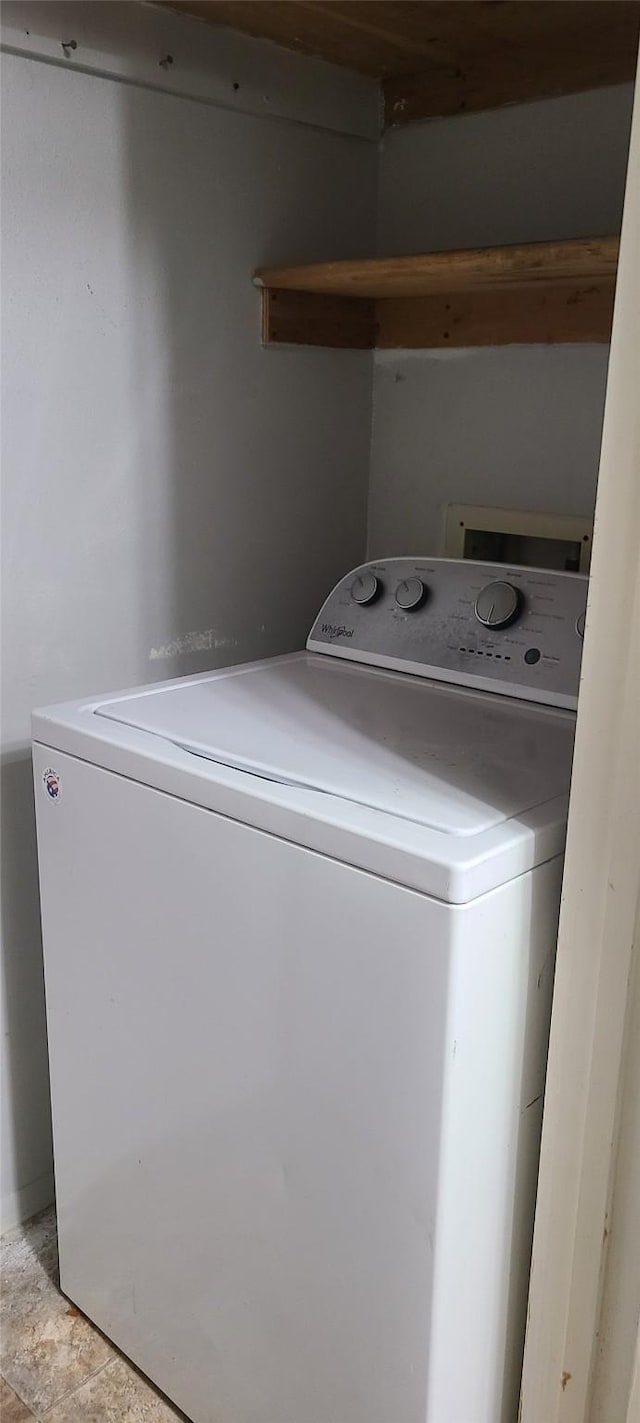 laundry room featuring washer / dryer and laundry area