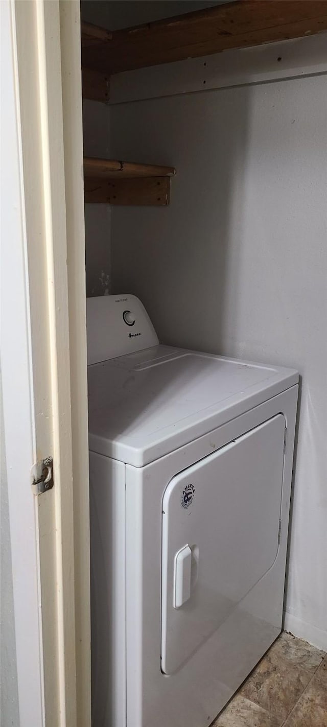 laundry area featuring laundry area and washer / clothes dryer