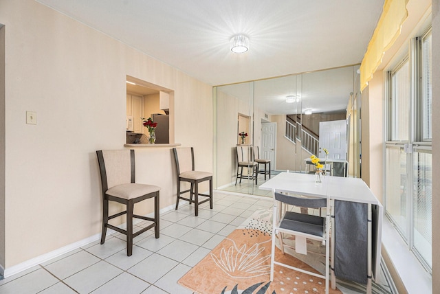 dining room featuring light tile patterned floors