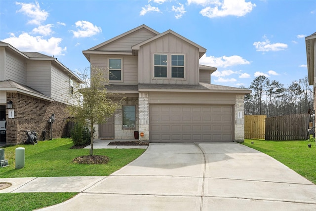 view of front of property featuring a garage and a front yard