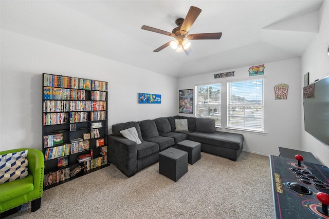 carpeted living room featuring ceiling fan and vaulted ceiling