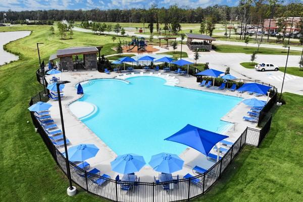 view of swimming pool with a patio and a yard