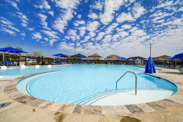 view of swimming pool featuring a patio area