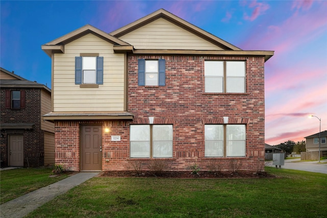 view of front of property with a yard